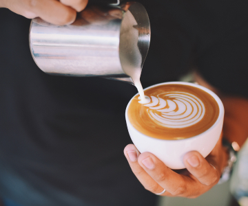 Someone pours fresh coffee